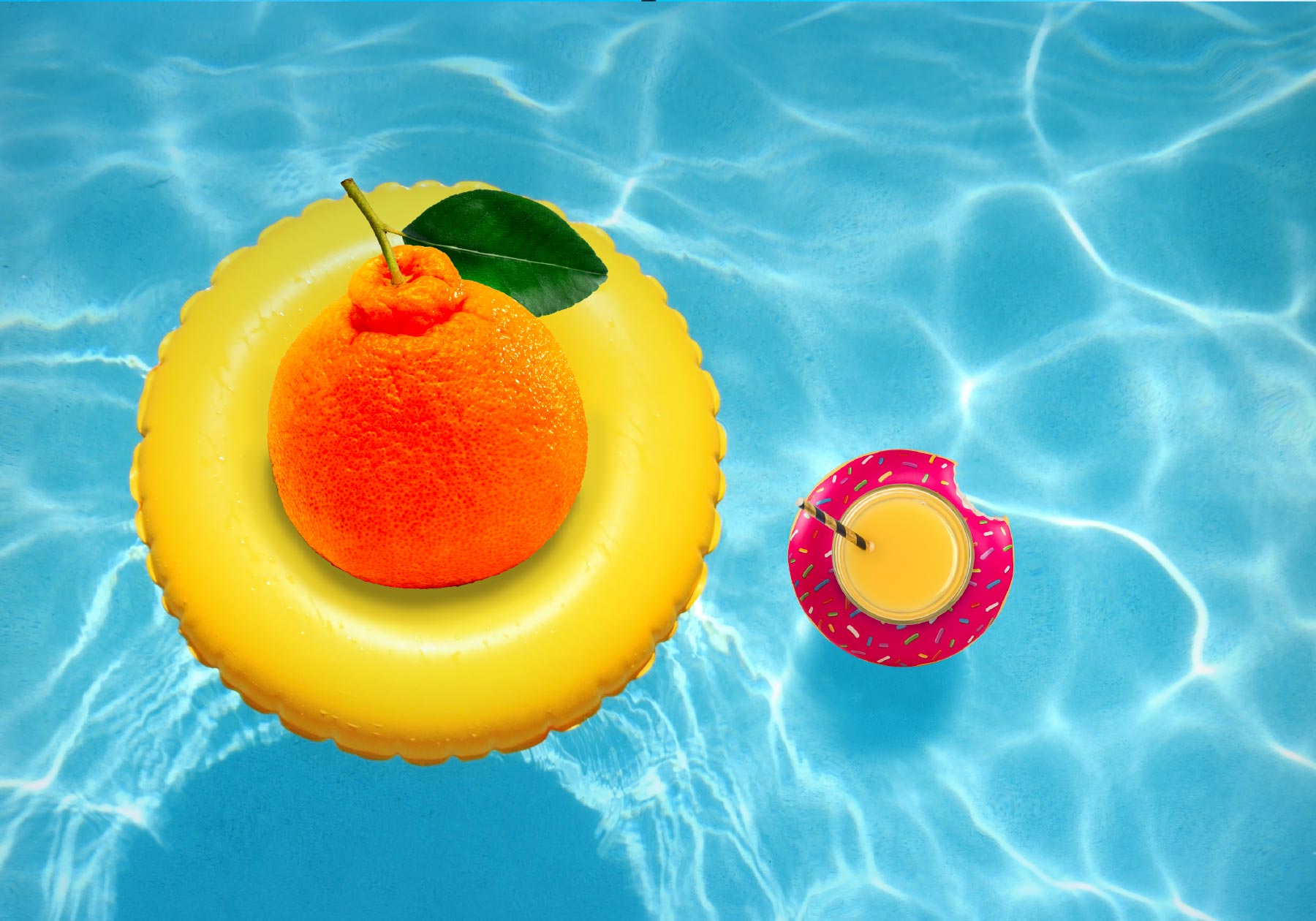 An orange relaxing in a pool on inflatable ring