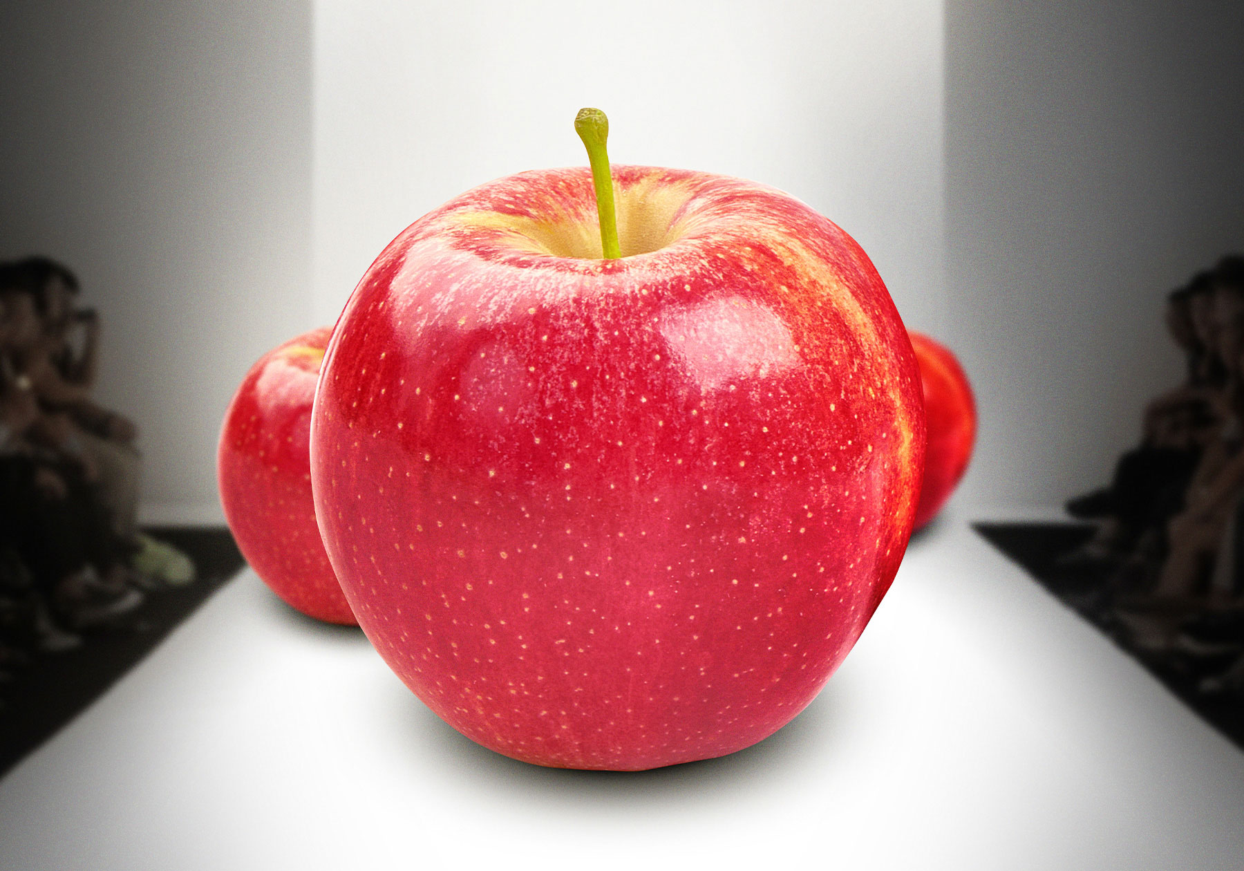 An apple relaxing in a chair on a sunny beach